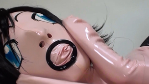 Chick poses in weird angel latex suit