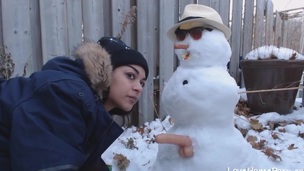 Beautiufl dilettante girl gets screwed from behind outdoors by snowman