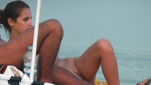 Girl with admirable boobs on the beach Espana voyeur movie