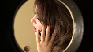 A brunette hair performs blow job on a large thick cock in the toilet