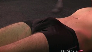 Serf boy licks Mistresses spit from the cage floor before a good beating