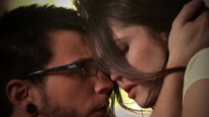 Passionate sex of winsome babe and bearded paramour in armchair