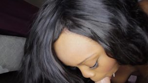 A black cutie that loves dick is swallowing semen from a white cock